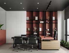 an office with red shelving and black leather chairs in front of a large window