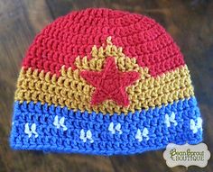 a crocheted hat with a red star on the front and blue, yellow, and white stripes