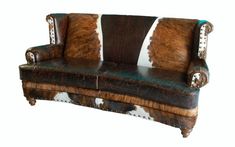 an animal print leather couch with cow hide upholstered on the armrests