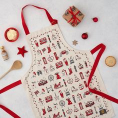 the apron is decorated with red ribbon and other things to decorate on it's side