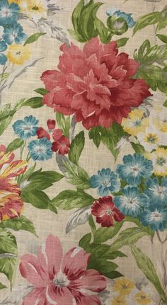 an image of a flowered fabric with many colors and flowers on it's side