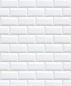 a white brick wall that is made out of tiles