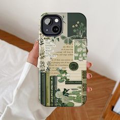 a woman is holding up her phone case with flowers and books on the cover,