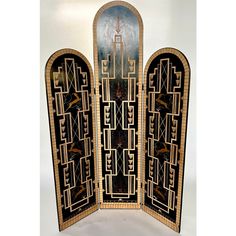 an art deco screen is shown in black and gold