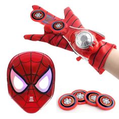 spider - man costume gloves and magnets are shown in front of a person's hand