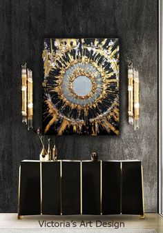 a black and gold room with art on the wall