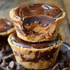 chocolate covered peanut butter cups stacked on top of each other with chocolate chips around them