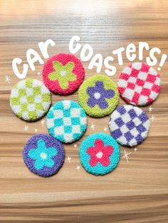 six colorful buttons with the words car coasters on them