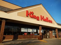 a king kulba store front with its doors open and the sky in the background