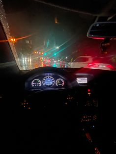 the dashboard of a car at night time