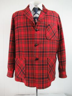 "Vintage 1970s Pendleton jacket. Made of red plaid wool. Has three pockets and a three button front. Made by Pendleton. Size medium. Actual measurements are: 46\" at the chest 44\" at the waist 19\" shoulder seam to shoulder seam 25\" shoulder seam to cuff 31\" overall length In very good condition except for a 1/8\" on left arm(photo)." Plaid Sport Coat With Welt Pockets For Fall, Plaid Lapel Collar Sport Coat For Winter, Winter Plaid Sport Coat With Lapel Collar, Winter Plaid Single Breasted Sport Coat, Casual Plaid Sport Coat With Pockets, Classic Plaid Tweed Jacket With Buttons, Plaid Sport Coat With Lapel Collar For Fall, Winter Plaid Sport Coat With Welt Pockets, Plaid Outerwear With Notch Lapel And Buttons