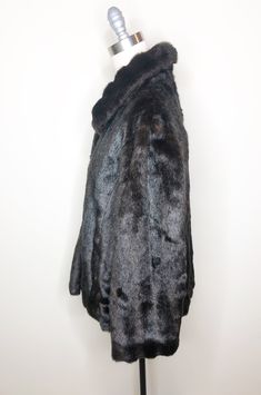 This is a faux fur, reversible jacket by Mackintosh, New England. The fur is soft and cozy and has the look of mink. The buttons look like horn and add a fun vintage flair. The reverse side is brown water resistant fabric, with fur trim. There is some creasing in the reverse fabric (see picture 7) which does not effect wearability. This is a stylish and very practical jacket, ready for whatever Mother Nature has in store. Size tag L. Check measurements carefully. Measurements taken with jacket l Brown Water, Peignoir Sets, Beaded Evening Bags, Printed Robe, Palm Beach Gardens, Reversible Jacket, Beach Gardens, Sleepwear Sets, Vintage Lingerie