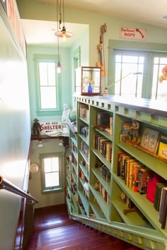 a room filled with lots of books on top of shelves