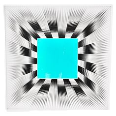 an abstract painting with black and white lines in the center, blue rectangle on top