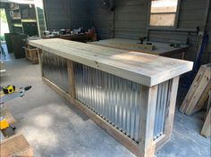 a bar made out of corrugated steel in a garage