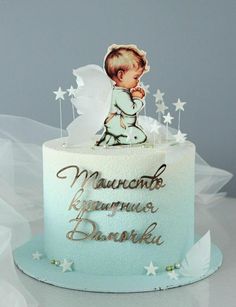 there is a cake with a baby on it and stars around the top that says maurano