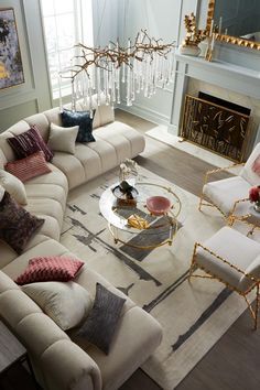 a living room filled with furniture and a fire place in the middle of the room