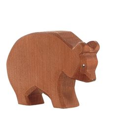 a wooden toy bear on a white background