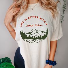 Experience the beauty of the outdoors with our Comfort Colors® Life Is Better With A Camp View Shirt! This Nature Shirt is perfect for camp enthusiasts and makes an ideal Camp Lover Gift. Share your love for camping with our stylish and comfortable Family Camping Shirt. Join the Camp Squad and celebrate the great outdoors with this Nature Lovers Shirt. Perfect for any adventure, this tee combines comfort, style, and a love for nature. Welcome to my Lively Colors Shirt store!  In my shop, you will find high quality Comfort Colors T-Shirt. My shirts are soft and regular relax fit.  Hey! Don't forget to see the drop-down menus for the sizes and colors that you would like to order.  And it is so important to check the size charts in the listings.  These are the information below about my produ Vintage Camp Tee, Camp Tshirt Designs, Family Camping Shirts, Design Camp, Camping Tee, Nature Shirts, Vintage Camping, Family Camping, Shirt Store