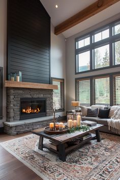 a living room filled with furniture and a fire place in front of a large window