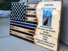 a wooden sign with an american flag and a dog's name on it that says, fortier