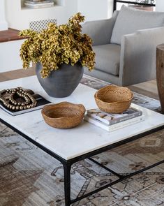 a coffee table with two bowls on it