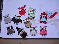 an assortment of owl cut outs sitting on top of a piece of paper