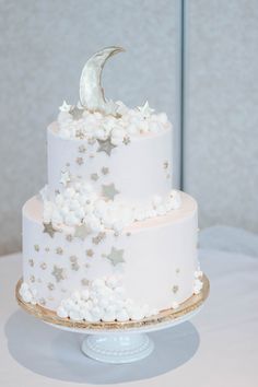 a white cake with stars and a moon on top