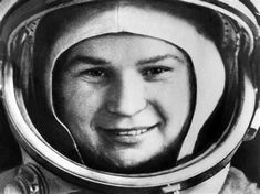 an old black and white photo of a man in a space suit