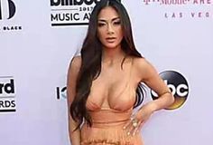 an image of a woman in a dress on the red carpet with her hands on her hips