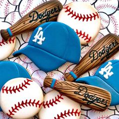 cookies decorated like baseballs and bats on a table