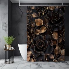 a black and gold rose shower curtain in a bathroom with a plant on the floor