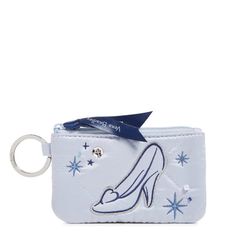 a white purse with a shoe on the front and star decorations on the outside, along with a keychain