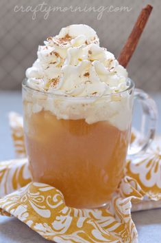 an iced drink with whipped cream and cinnamon on top