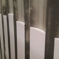 a close up of a radiator in a room with metal bars on the wall