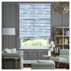 a living room with blue and white striped blinds