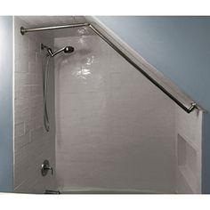 a bathroom with blue walls and white tile on the floor, including a shower head