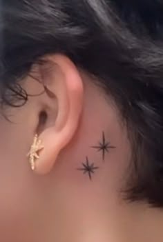 a woman with stars behind her ear