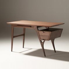 a wooden desk with two drawers on it's sides and an open drawer at the top