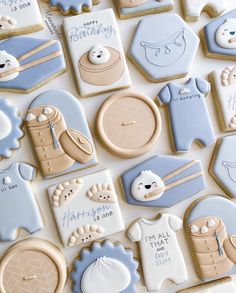 baby shower cookies are arranged on a table