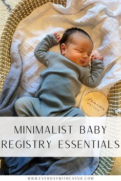 a baby sleeping in a basket with the words minimalist baby registry essentials