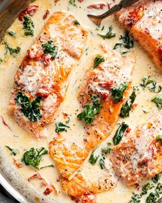 salmon with spinach and parmesan sauce in a skillet