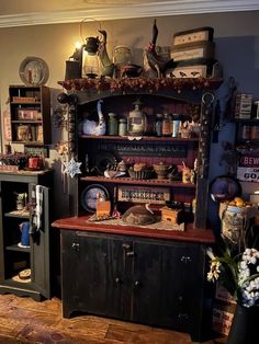 a room filled with lots of different types of items on shelves and cupboards next to each other