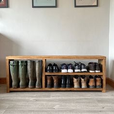 a wooden shoe rack filled with lots of shoes