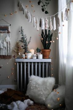 a room with a radiator, plants and lights