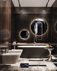 a modern bathroom with two sinks and three mirrors on the wall, along with an oval tub