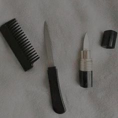 three different types of hair brushes and combs on a white towel next to each other