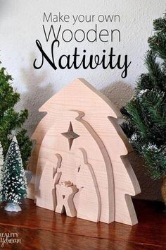 a wooden nativity scene with christmas trees