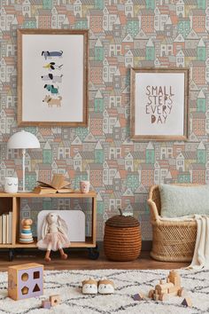 a living room with colorful wallpaper and wooden toys on the floor in front of it