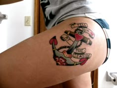 a woman with a tattoo on her thigh shows off her anchor and heart design, which reads fill the rest